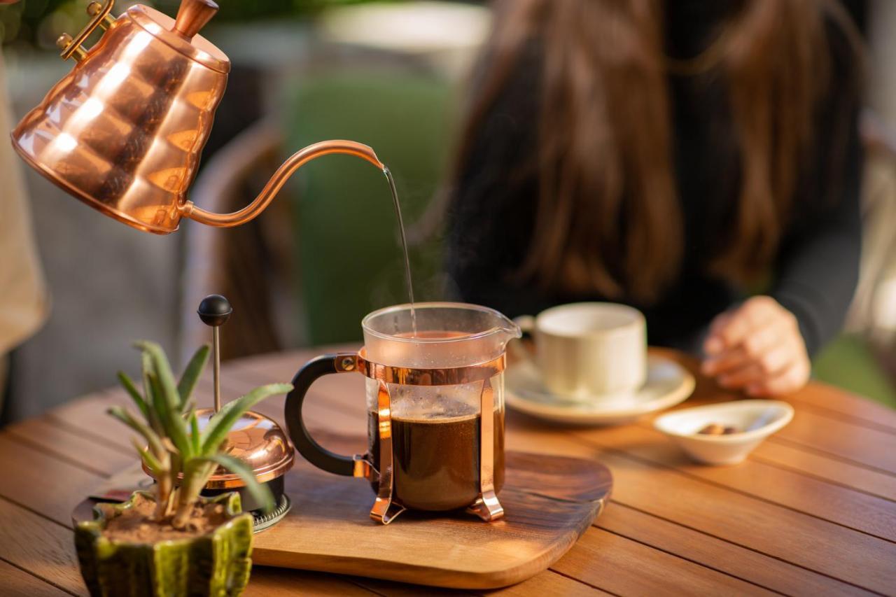 Hotel Jadali&Spa Marrakesch Exterior foto A copper kettle and a glass cup