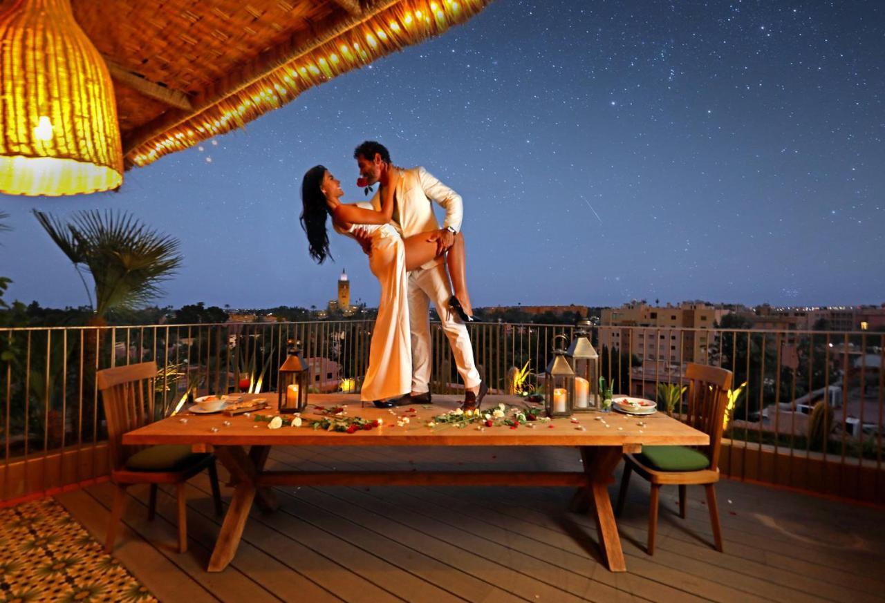 Hotel Jadali&Spa Marrakesch Exterior foto A couple dancing on a rooftop